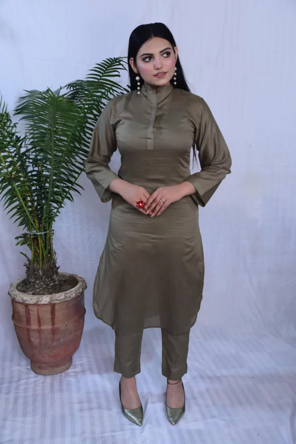Girl in beautiful plain light grey dress.