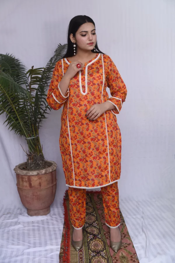 A women in printed orange floral design dress