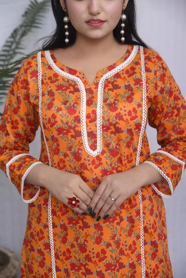 Women in two printed orange floral design dress